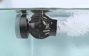 An aquarium wave maker mounted on the side of the tank, closer to the surface, pushing the water to create waves